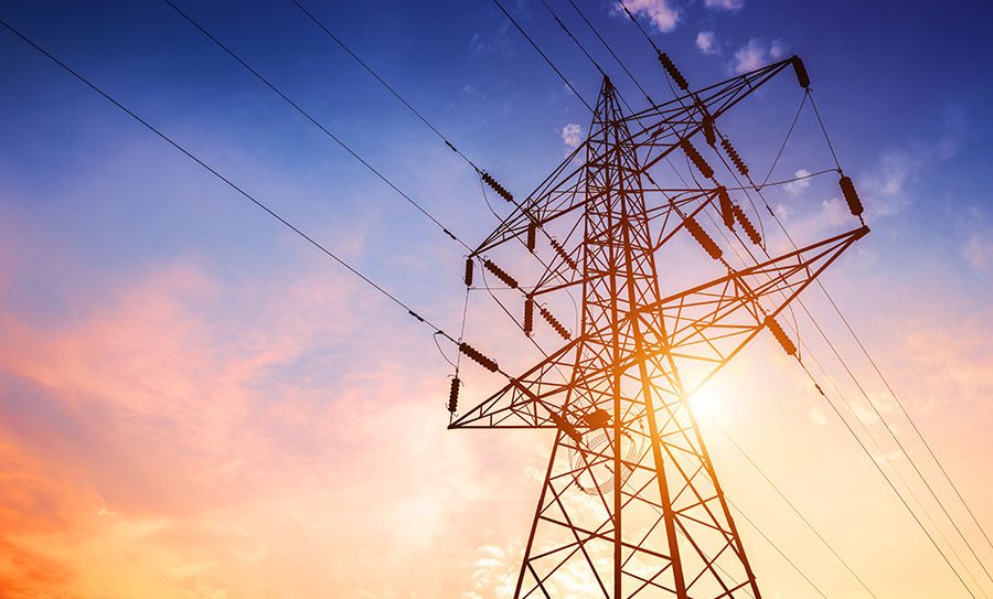 A large metal tower carrying power lines