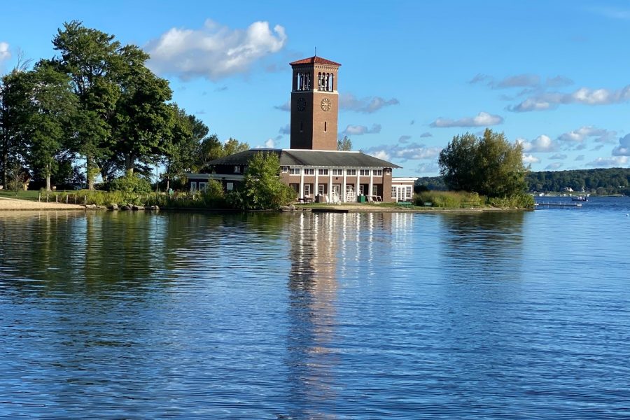 A clock tower and historical building on the bank of Lake Erie