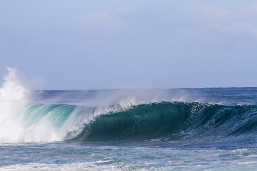 A wave in a blue-green ocean. Photo by Jeremy Bishop via Unsplash.