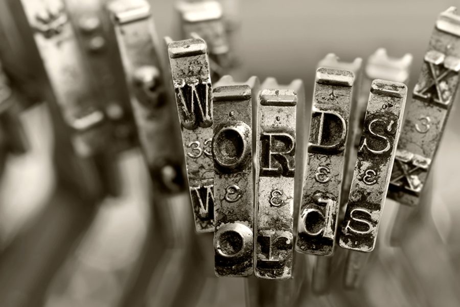 Typebars from an antique typewriter are clustered to spell out 