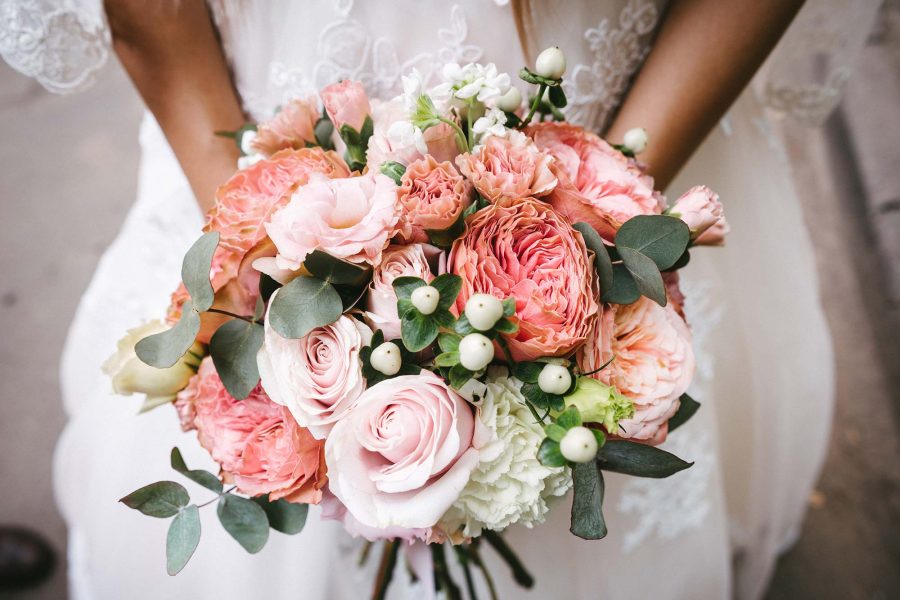 A wedding bouquet in the arms of a bride