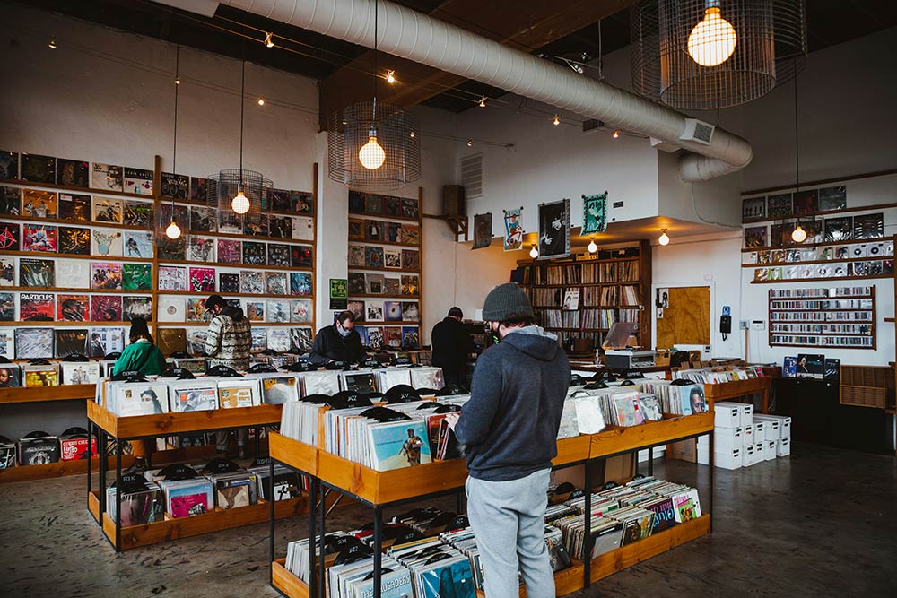 People shop at a record store in Portland, OR. 