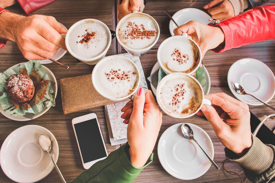 A group of friends who like to support small businesses gather at a local coffee shop