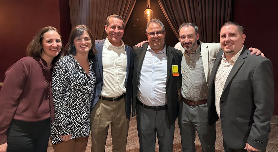 Group photo of the Camoin Associates staff who attended the 2024 International Economic Development Council's annual conference in Denver