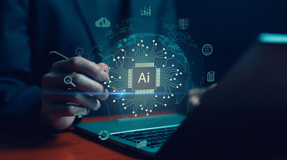A person wearing a suit sits in front of a laptop computer. An image of the Earth covered by a computer chip with "AI" written on it floats in front of them, along with a variety of icons representing technology, data, innovation, and digital tools.