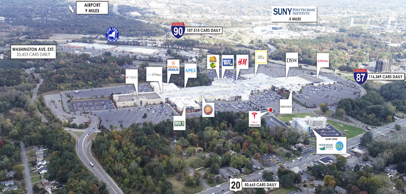 An aerial photo of the development site shows the location of a variety of retail, lodging, and residential buildings