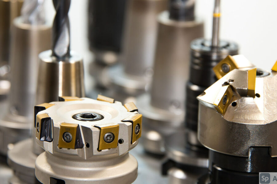 A close-up image of different types drill bits and other attachments used in industrial manufacturing.